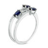 Thumbnail Image 1 of Oval Blue Sapphire and 1/10 CT. T.W. Diamond Three Stone Wrap Ring in 10K White Gold