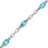 Thumbnail Image 1 of Oval Swiss Blue Topaz Infinity Link Bracelet in Sterling Silver - 7.25"