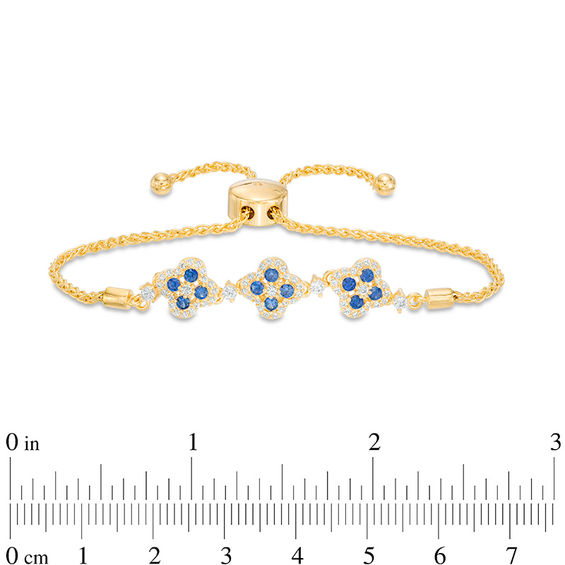 Lab-Created Blue and White Sapphire Triple Flower Bolo Bracelet in Sterling Silver with 18K Gold Plate - 9.0"
