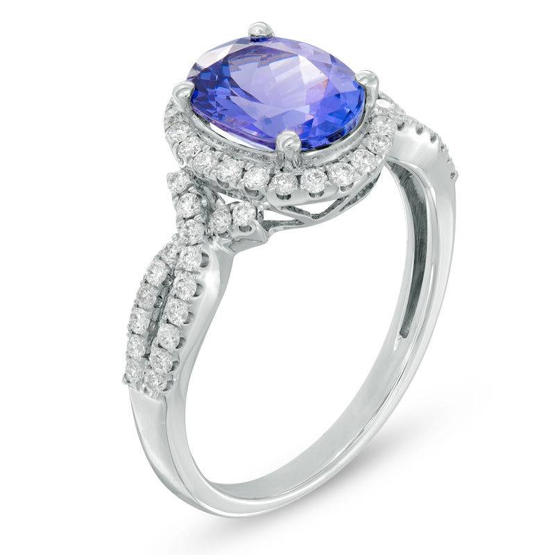 Oval Tanzanite and 3/8 CT. T.W. Diamond Frame Twist Shank Ring in 14K White Gold