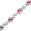 Thumbnail Image 0 of Lab-Created Ruby and 1/4 CT. T.W. Diamond Swirl Three Stone Bracelet in Sterling Silver - 7.5"