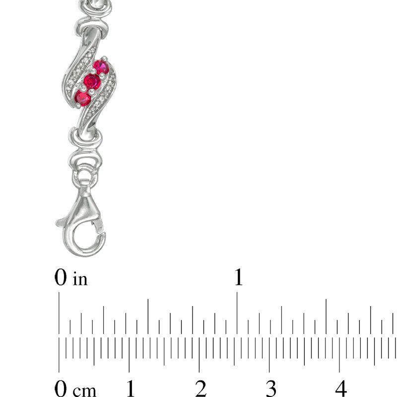 Lab-Created Ruby and 1/4 CT. T.W. Diamond Swirl Three Stone Bracelet in Sterling Silver - 7.5"