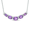 Thumbnail Image 0 of Oval Amethyst and 1/10 CT. T.W. Diamond Graduated Five Stone Necklace in Sterling Silver