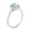 Thumbnail Image 1 of Oval Aquamarine and 1/10 CT. T.W. Diamond Flower Frame Ring in 10K White Gold