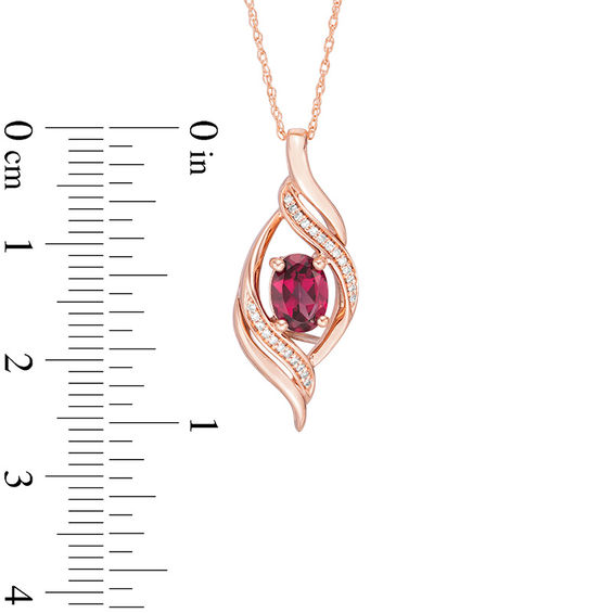 Oval Rhodolite Garnet and 1/20 CT. T.w. Diamond Open Flame Pendant in 10K Rose Gold