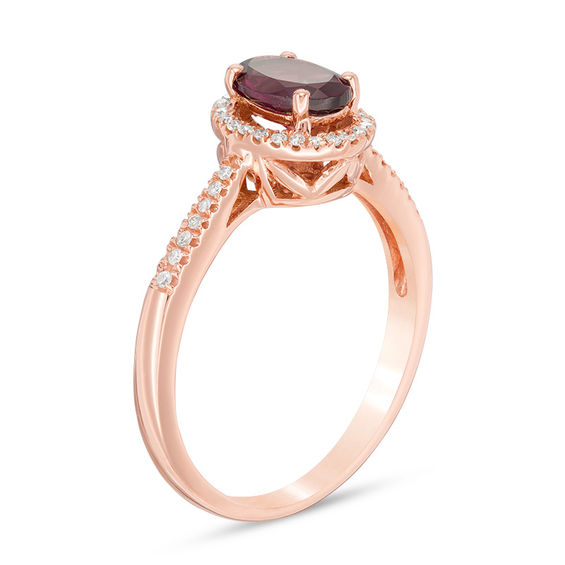 Oval Rhodolite Garnet and 1/10 CT. T.w. Diamond Frame Ring in 10K Rose Gold