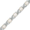 Thumbnail Image 1 of 5.0mm Baroque Freshwater Cultured Pearl and Diamond Accent "XO" Bracelet in Sterling Silver-7.5"
