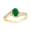 Thumbnail Image 0 of Oval Emerald and 1/8 CT. T.W. Diamond Tri-Sides Bypass Ring in 10K Gold