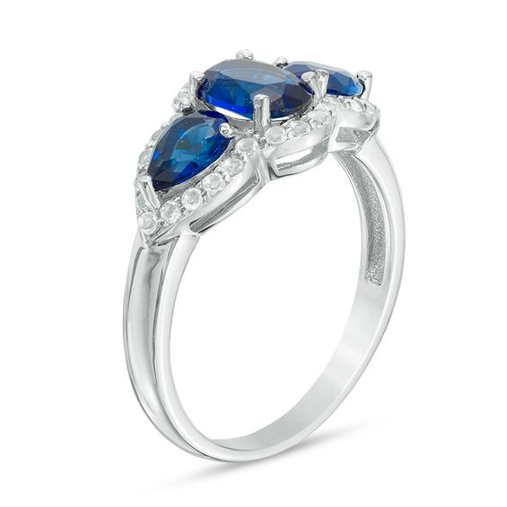 Oval and Pear-Shaped Lab-Created Blue Sapphire with White Topaz Frame Three Stone Ring in Sterling Silver Oval and Pear-Shaped Lab-Created Blue Sapphire with White Topaz Frame Three Stone Ring in Sterling Silver