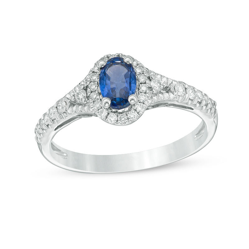 Oval Blue Sapphire and 1/5 CT. T.W. Diamond Frame Ring in 10K White Gold