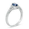 Thumbnail Image 1 of Oval Blue Sapphire and 1/5 CT. T.W. Diamond Frame Ring in 10K White Gold