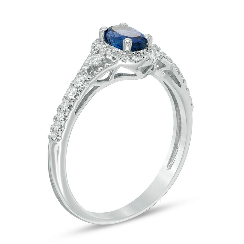 Oval Blue Sapphire and 1/5 CT. T.W. Diamond Frame Ring in 10K White Gold