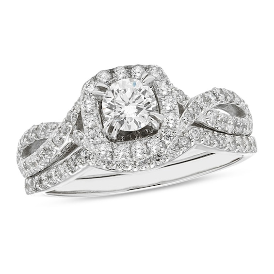 1 CT. T.w. Certified Diamond Cushion Frame Twist Shank Bridal Set (I/I2)