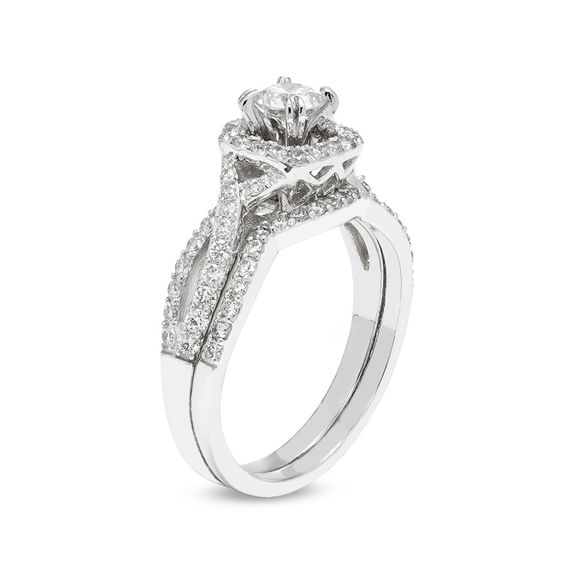 1 CT. T.w. Certified Diamond Cushion Frame Twist Shank Bridal Set (I/I2)