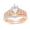 Thumbnail Image 0 of Lab-Created Marquise White Sapphire and 1/5 CT. T.W. Diamond Bridal Set in 10K Rose Gold