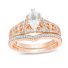 Thumbnail Image 1 of Lab-Created Marquise White Sapphire and 1/5 CT. T.W. Diamond Bridal Set in 10K Rose Gold