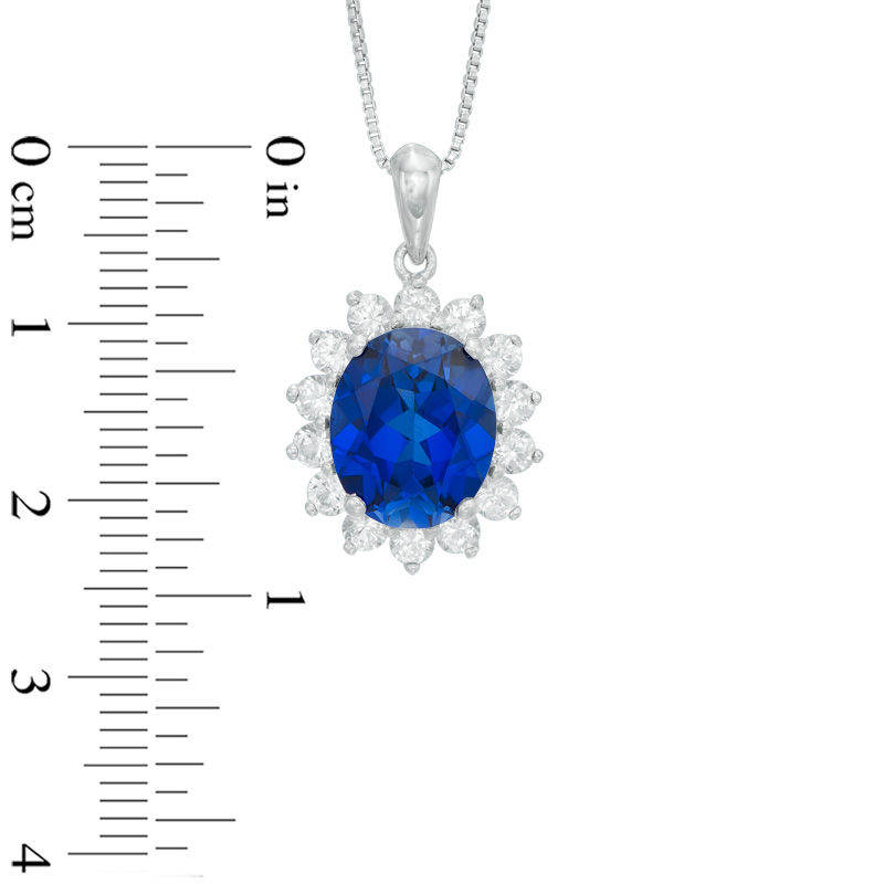 Oval Lab-Created Blue Sapphire and White Sapphire Sunburst Frame Pendant in Sterling Silver