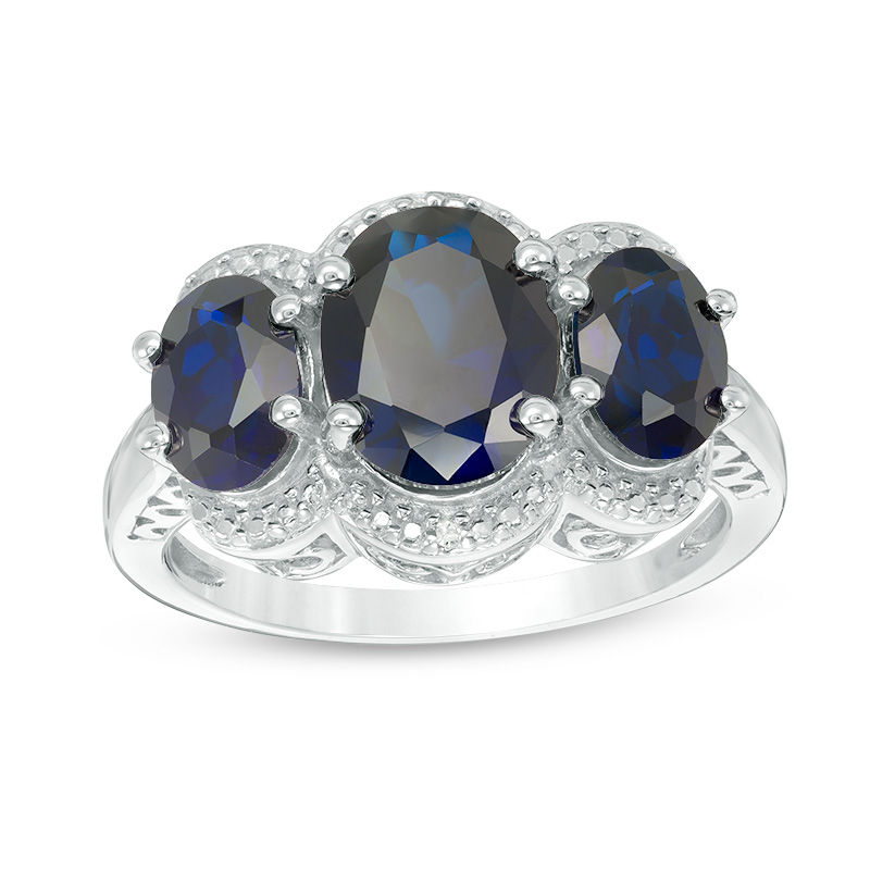 Oval Lab-Created Blue Sapphire and Diamond Accent Three Stone Frame Ring in Sterling Silver