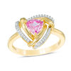 Thumbnail Image 0 of 6.0mm Trillion-Cut Lab-Created Pink Sapphire and 1/10 CT. T.W. Diamond Swirl Frame Ring in 10K Gold