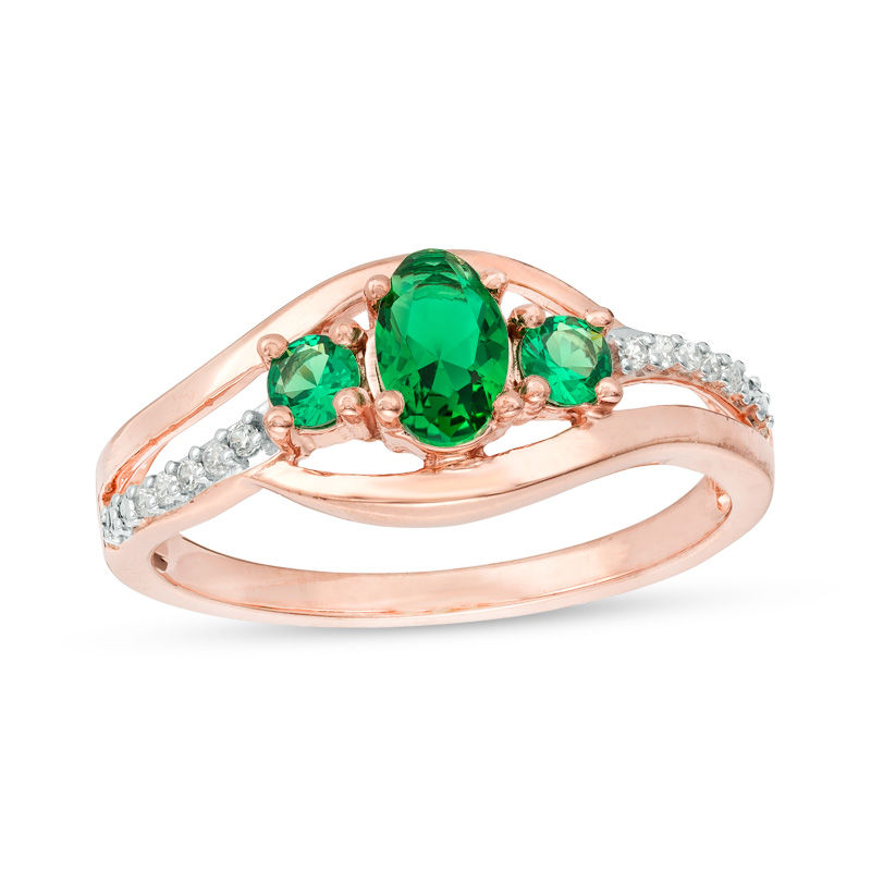 Oval Lab-Created Emerald and 1/20 CT. T.W. Diamond Three Stone Bypass Engagement Ring in 10K Rose Gold