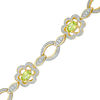 Thumbnail Image 1 of Oval Peridot and Diamond Accent Flower Link Bracelet in Sterling Silver with 14K Gold Plate - 7.25"