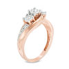 Thumbnail Image 1 of 1/4 CT. T.W. Diamond Past Present Future® Twist Bypass Engagement Ring in 10K Rose Gold