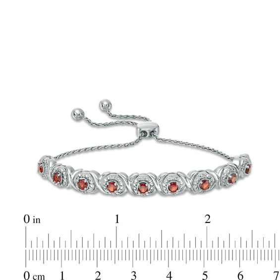 Garnet and 1/10 CT. T.w. Diamond Frame Bolo Bracelet in Sterling Silver - 9.5"