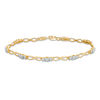 Thumbnail Image 1 of 1/10 CT. T.W. Diamond Three Stone Infinity Bracelet in 10K Gold - 7.25"