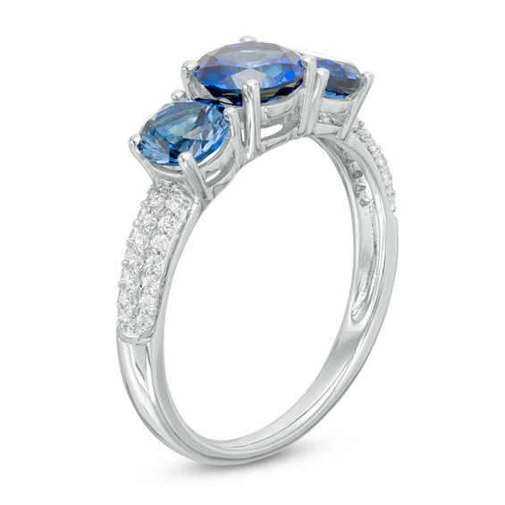 Lab-Created Blue Sapphire and 1/8 CT. T.w. Diamond Three Stone Ring in 10K White Gold