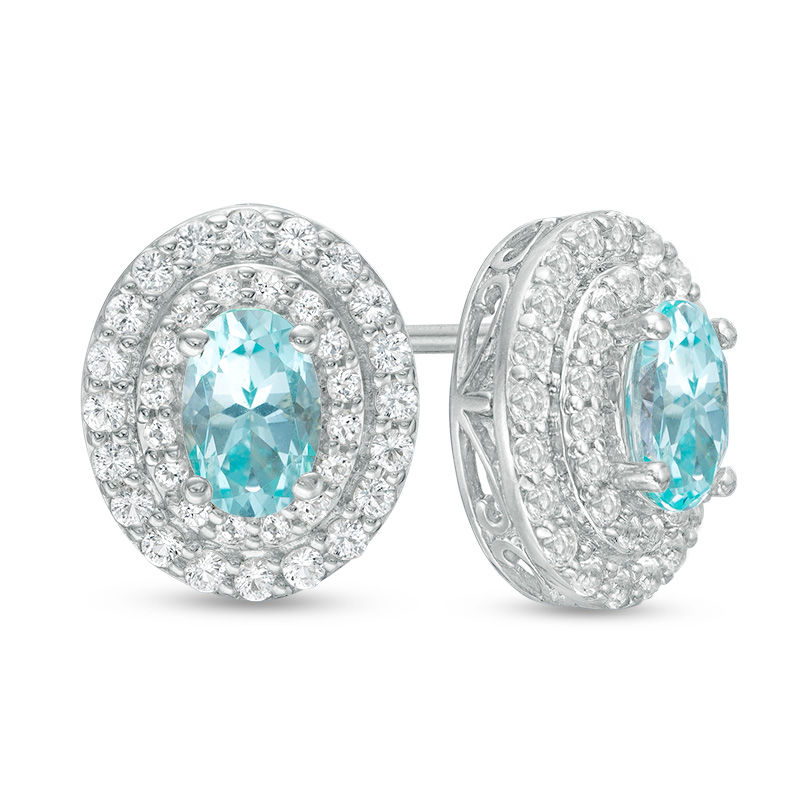 Main Image 1 of Oval Blue and White Topaz Frame Stud Earrings in Sterling Silver