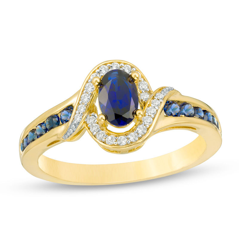 Main Image 1 of Oval Blue Sapphire and 1/10 CT. T.W. Diamond Bypass Frame Ring in 10K Gold