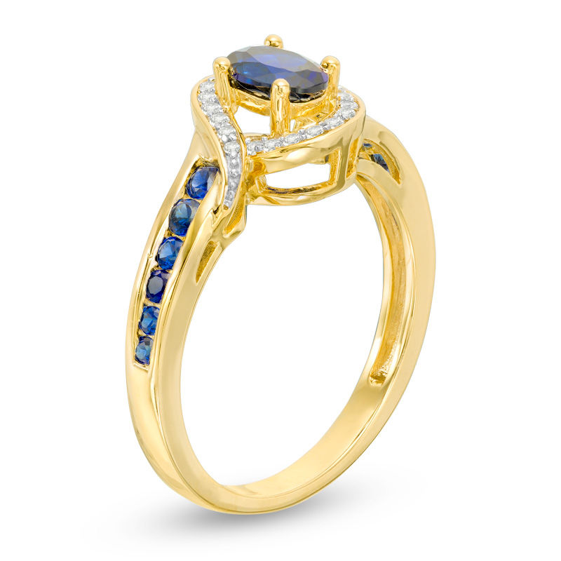 Main Image 2 of Oval Blue Sapphire and 1/10 CT. T.W. Diamond Bypass Frame Ring in 10K Gold