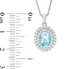 Thumbnail Image 1 of Oval Blue and White Topaz Frame Pendant in Sterling Silver