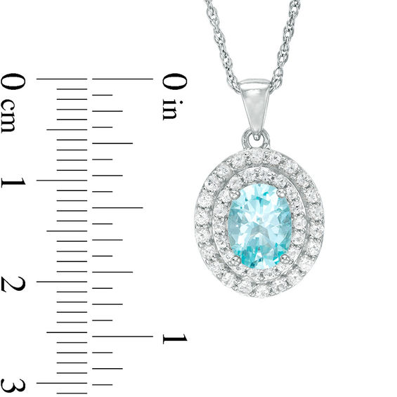 Oval Blue and White Topaz Frame Pendant in Sterling Silver