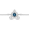 Thumbnail Image 1 of Enchanted Disney Cinderella Oval Blue Topaz and 1/10 CT. T.W. Diamond Carriage Bolo Bracelet in Sterling Silver - 9.5"