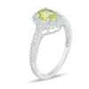 Thumbnail Image 1 of Oval Peridot and 1/8 CT. T.W. Diamond Frame Vintage-Style Ring in 10K White Gold