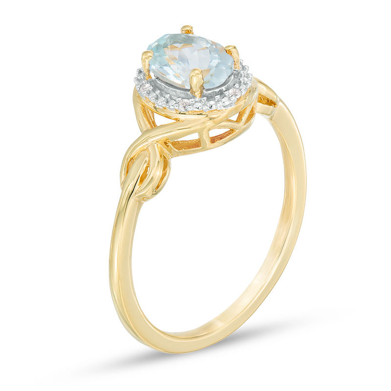 Main Image 2 of Oval Aquamarine and Diamond Accent Twist Ring in 10K Gold