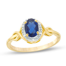 Oval Lab-Created Blue Sapphire and Diamond Accent Twist Ring in 10K Gold