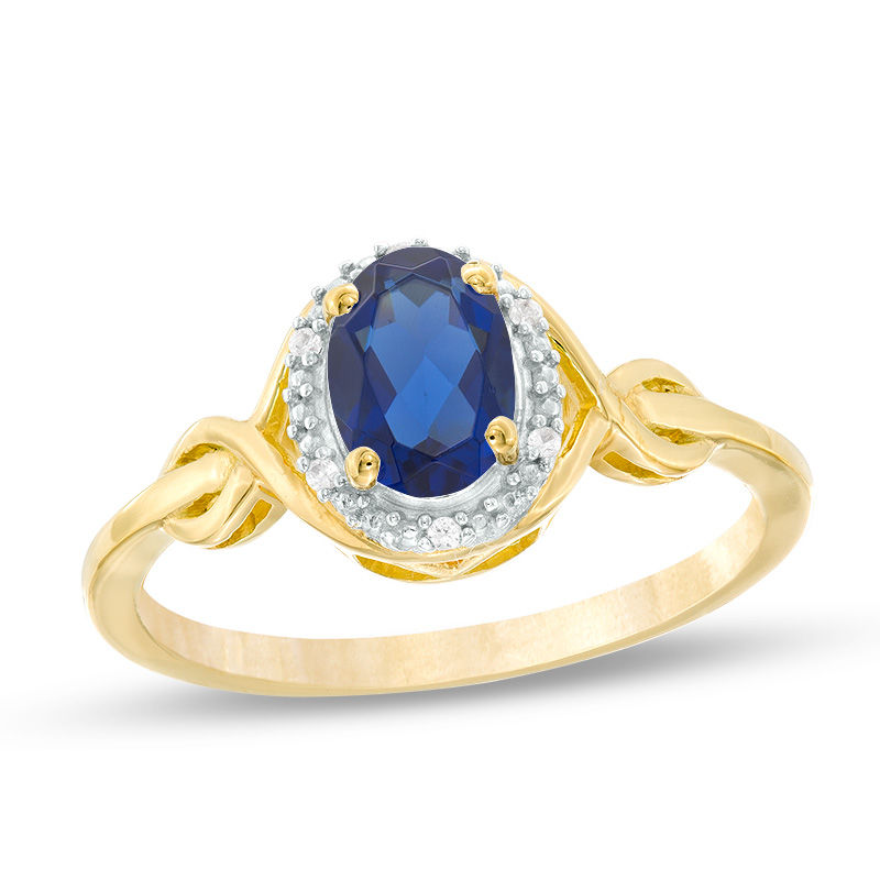 Main Image 1 of Oval Lab-Created Blue Sapphire and Diamond Accent Twist Ring in 10K Gold