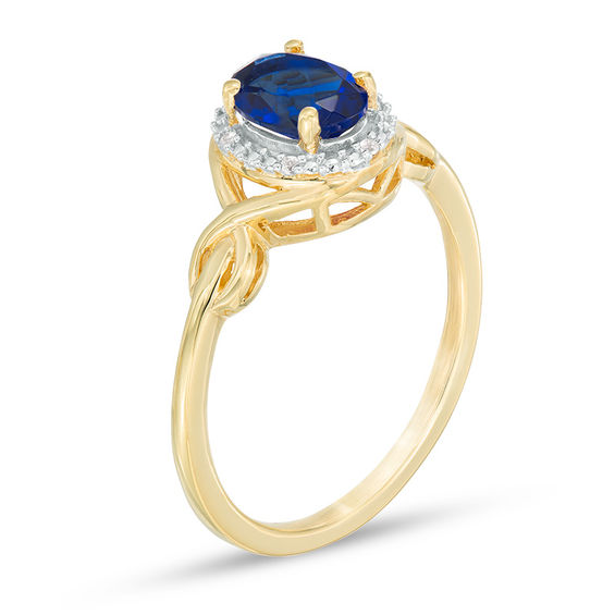 Oval Lab-Created Blue Sapphire and Diamond Accent Twist Ring in 10K Gold