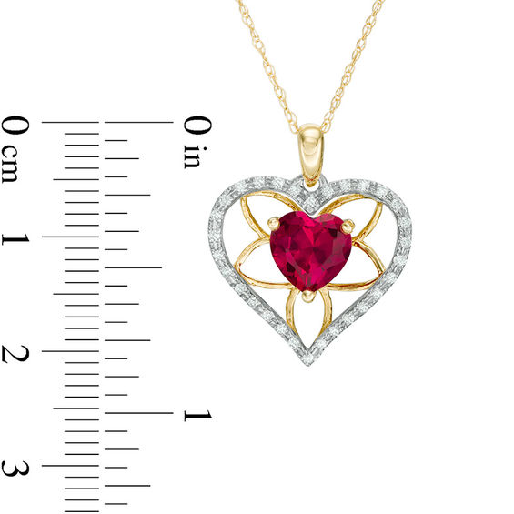 7.0mm Heart-Shaped Lab-Created Ruby and 1/8 CT. T.w. Diamond Floral Heart Pendant in 10K Gold