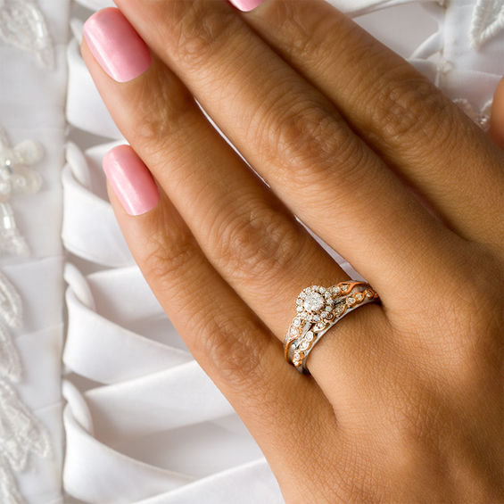 3/8 CT. T.w. Diamond Frame Interlocking Bridal Set in 10K Two-Tone Gold