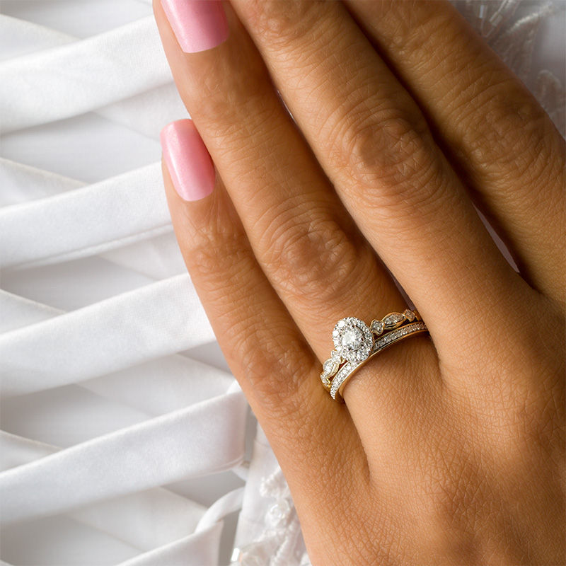 Main Image 3 of 1/2 CT. T.W. Diamond Oval Frame Interlocking Bridal Set in 10K Gold
