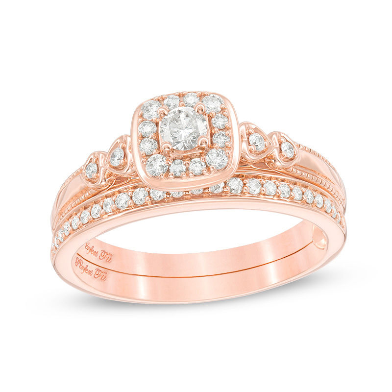 3/8 CT. T.W. Diamond Cushion Frame Interlocking Bridal Set in 10K Rose Gold