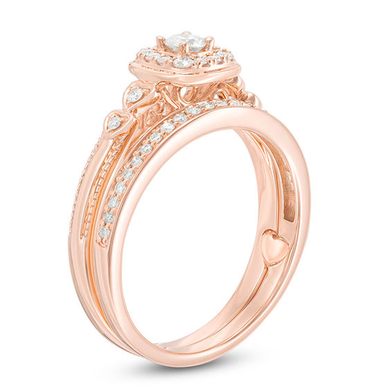 3/8 CT. T.w. Diamond Cushion Frame Interlocking Bridal Set in 10K Rose Gold