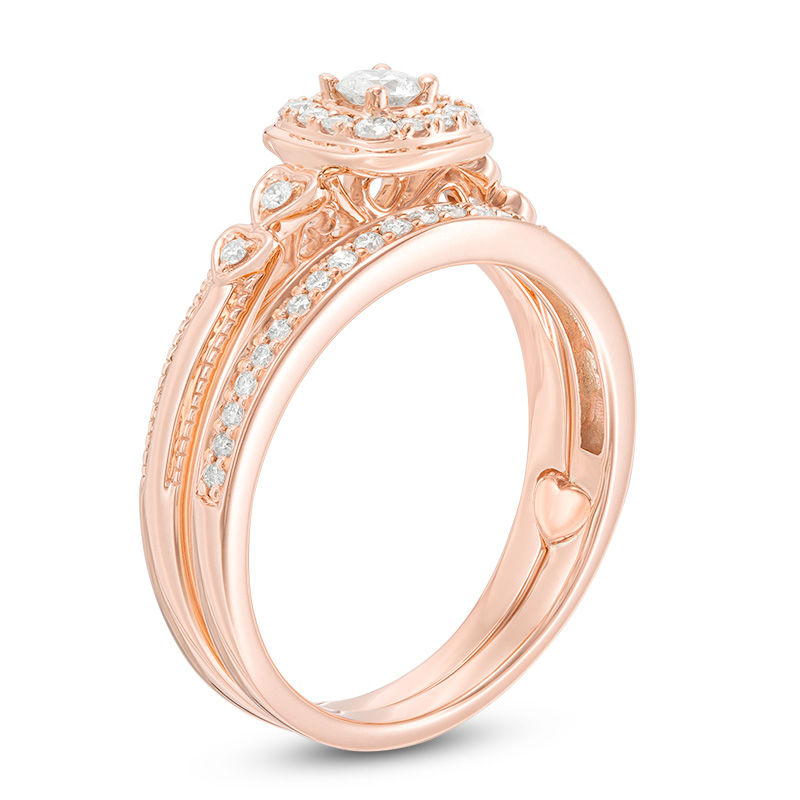 3/8 CT. T.W. Diamond Cushion Frame Interlocking Bridal Set in 10K Rose Gold