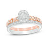Thumbnail Image 1 of 1/2 CT. T.W. Diamond Oval Frame Interlocking Bridal Set in 10K Two-Tone Gold