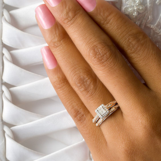 1/3 CT. T.w. Quad Princess-Cut Diamond Frame Interlocking Bridal Set in 10K Two-Tone Gold