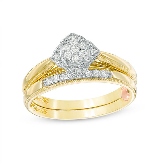1/6 CT. T.w. Composite Diamond Flower Vintage-Style Interlocking Bridal Set in 10K Gold