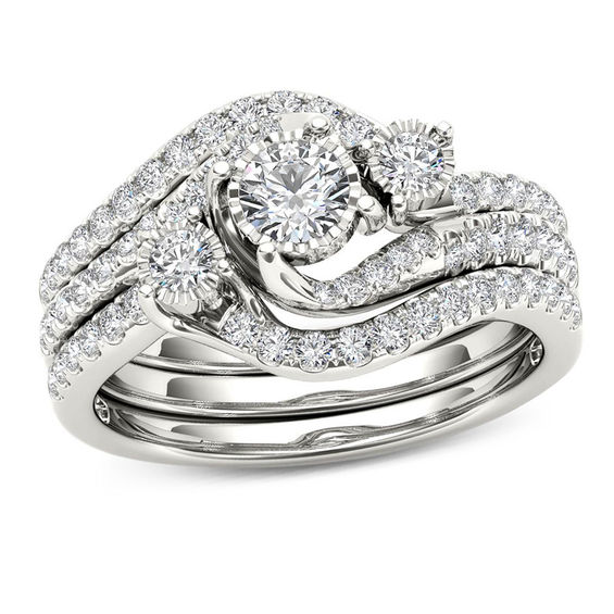 3/4 CT. T.W. Diamond Three Stone Bypass Three Piece Bridal Set in 14K White Gold 3/4 CT. T.W. Diamond Three Stone Bypass Three Piece Bridal Set in 14K White Gold
